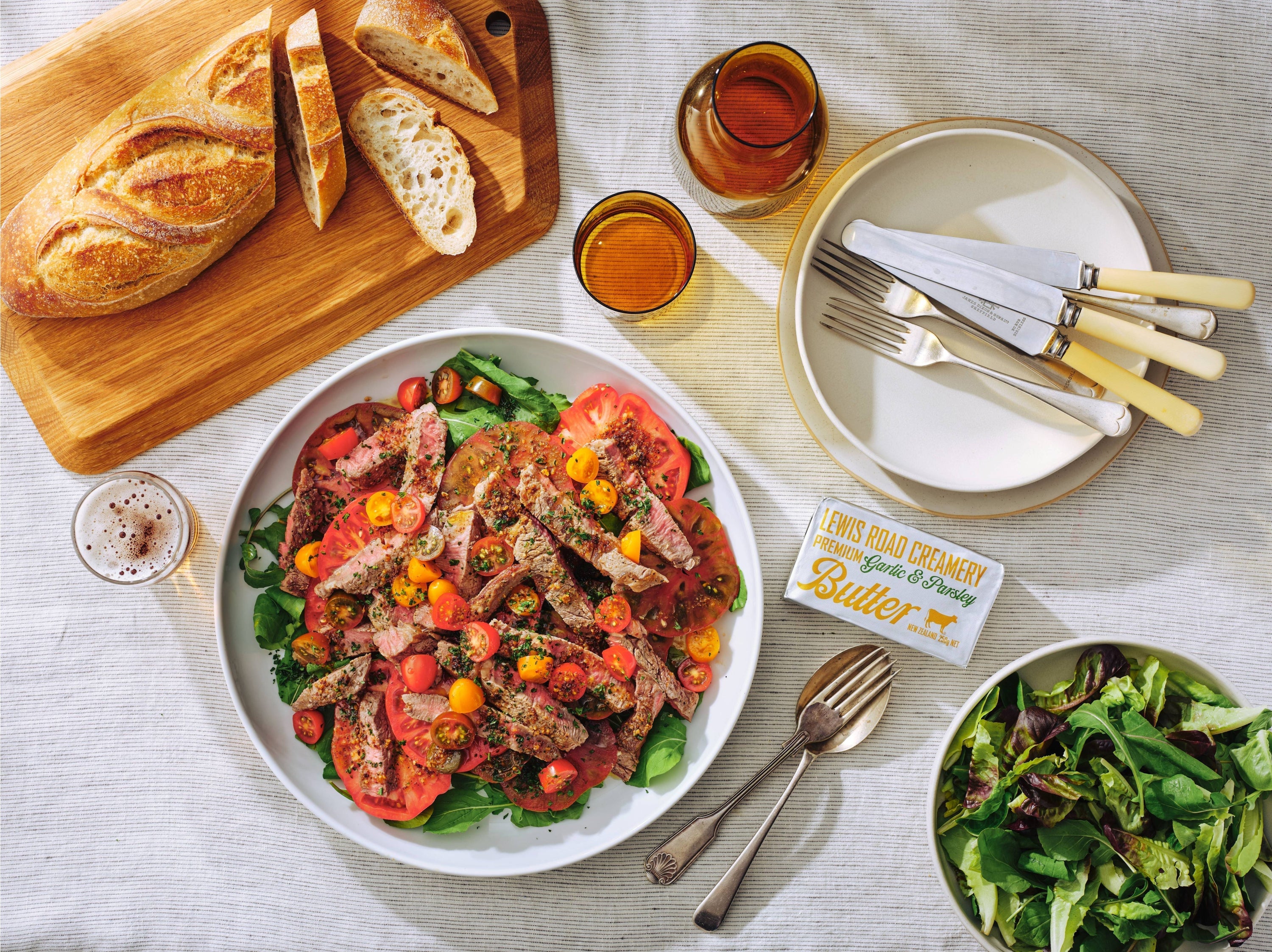 Garlic & Parsley Butter Steaks with Tomato Salad